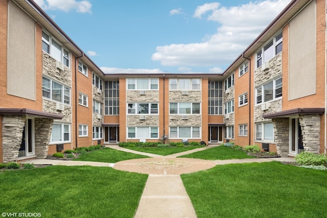 view of property's community with a yard