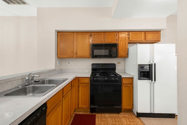 8235 Ripple Rdg, Darien, IL 60561 - kitchen featuring black appliances, a sink, light countertops, and brown cabinetry
