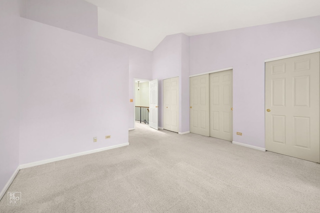 8235 Ripple Rdg, Darien, IL 60561 - unfurnished bedroom featuring carpet floors, baseboards, multiple closets, and lofted ceiling
