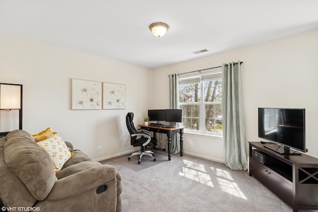 office area with baseboards, carpet, and visible vents