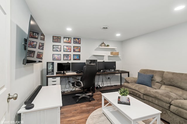 home office featuring recessed lighting, wood finished floors, and visible vents