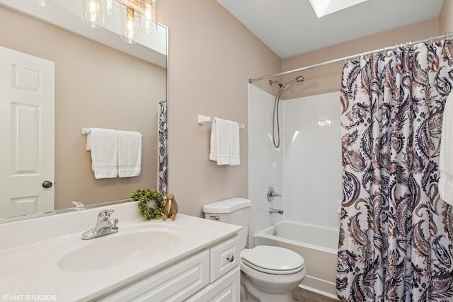bathroom with toilet, shower / bath combo, and vanity