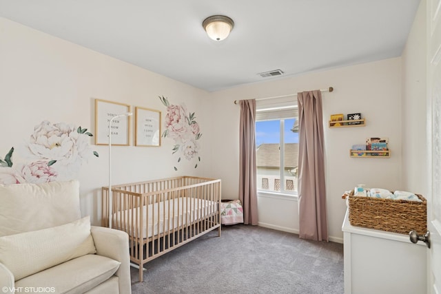 carpeted bedroom featuring a nursery area, baseboards, and visible vents
