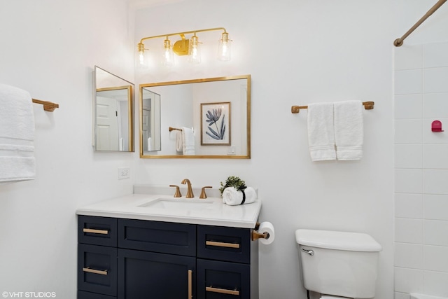 bathroom featuring vanity and toilet