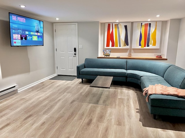 living room with recessed lighting, wood finished floors, and baseboards