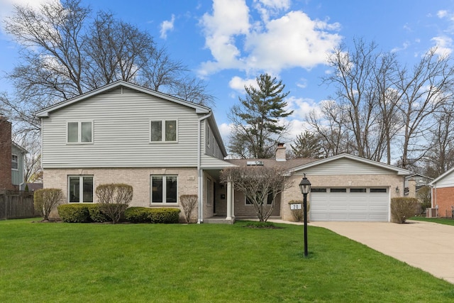 20 Colony Ln, Deerfield, IL 60015 - view of front of property with brick siding, concrete driveway, a garage, and cooling unit