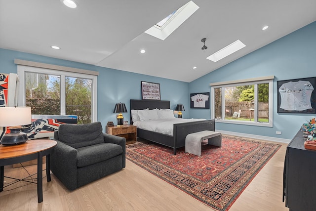 20 Colony Ln, Deerfield, IL 60015 - bedroom featuring a skylight, vaulted ceiling, multiple windows, wood finished floors, and recessed lighting