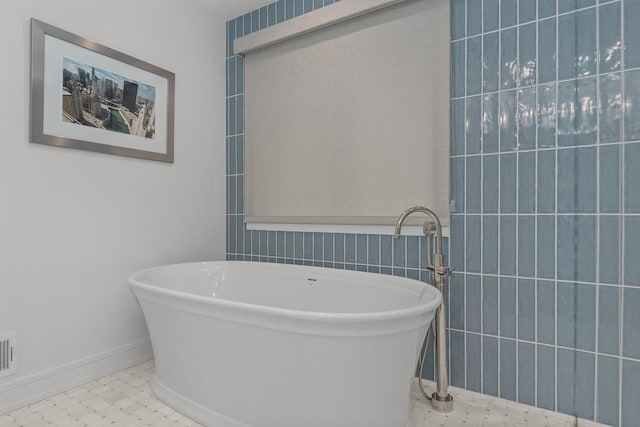 20 Colony Ln, Deerfield, IL 60015 - bathroom featuring a soaking tub, tile walls, and baseboards
