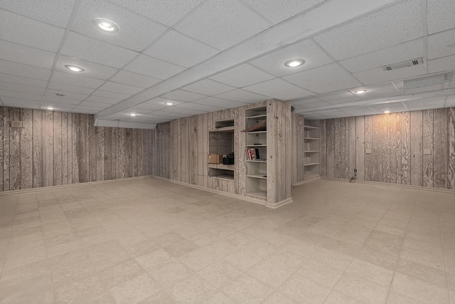 20 Colony Ln, Deerfield, IL 60015 - finished basement featuring tile patterned floors, wood walls, a paneled ceiling, recessed lighting, and baseboards