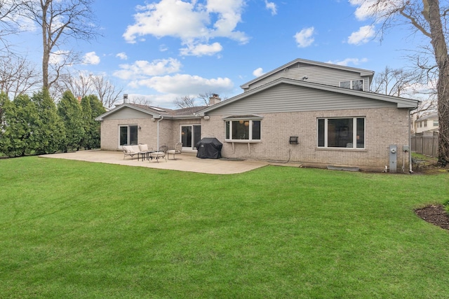 20 Colony Ln, Deerfield, IL 60015 - rear view of house with brick siding, a patio area, and a chimney