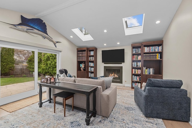20 Colony Ln, Deerfield, IL 60015 - living area featuring a skylight, a lit fireplace, wood finished floors, and recessed lighting