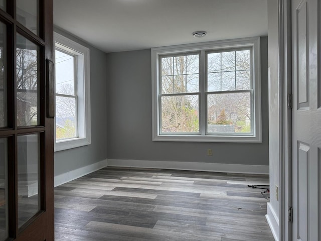 310 Elk St, Galena, IL 61036 - unfurnished room with baseboards, wood finished floors, and visible vents