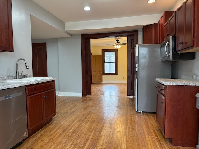 310 Elk St, Galena, IL 61036 - kitchen with baseboards, appliances with stainless steel finishes, a sink, and light countertops