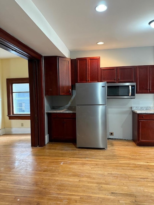 310 Elk St, Galena, IL 61036 - kitchen featuring dark brown cabinets, stainless steel appliances, light wood finished floors, and recessed lighting