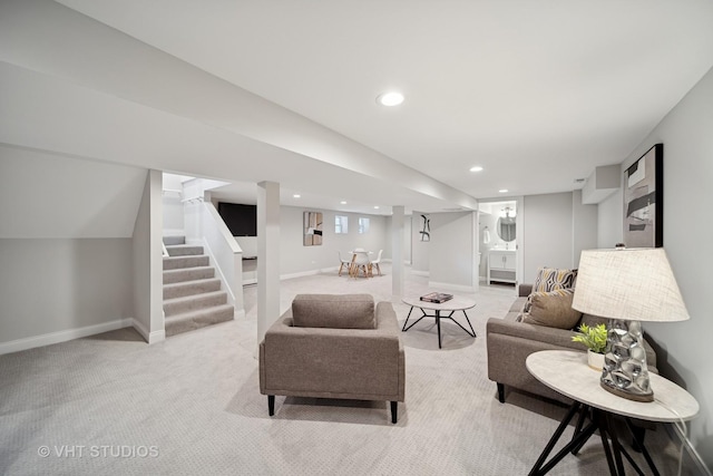 living area featuring stairway, baseboards, recessed lighting, and light colored carpet