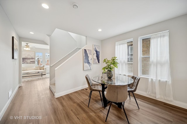 dining space with light wood-style floors, baseboards, and recessed lighting