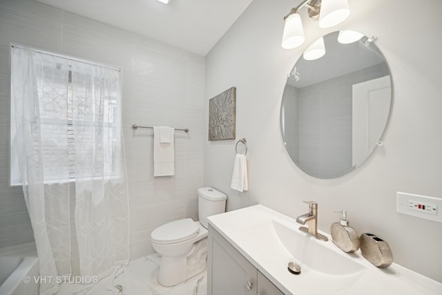 full bathroom with vanity, marble finish floor, toilet, and shower / tub combo