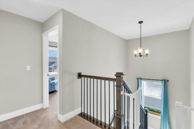715 Cole Ln, Mahomet, IL 61853 - stairway with baseboards, a notable chandelier, and carpet floors