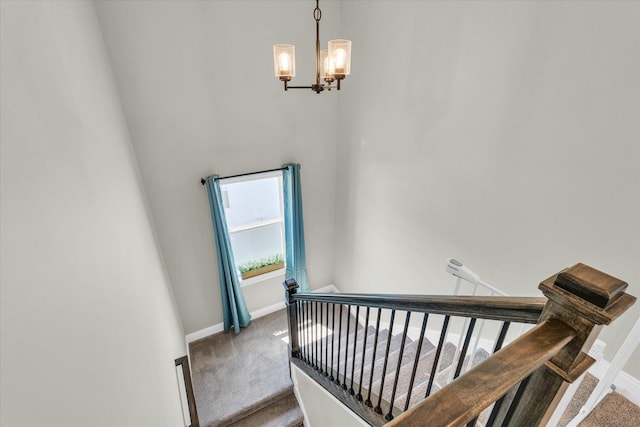 715 Cole Ln, Mahomet, IL 61853 - stairs featuring carpet flooring, baseboards, and a notable chandelier