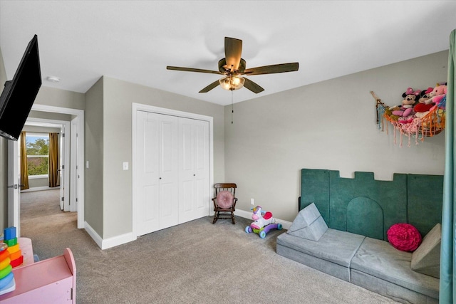 game room with carpet floors, baseboards, and a ceiling fan