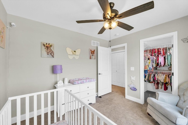 715 Cole Ln, Mahomet, IL 61853 - bedroom featuring a closet, visible vents, light carpet, a crib, and baseboards