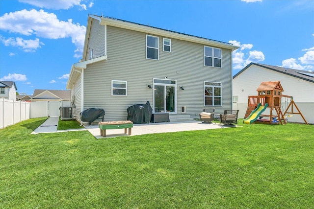 715 Cole Ln, Mahomet, IL 61853 - rear view of house with a lawn, a playground, a patio, and fence