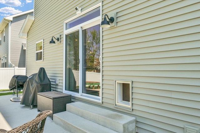 exterior space featuring a patio area and fence