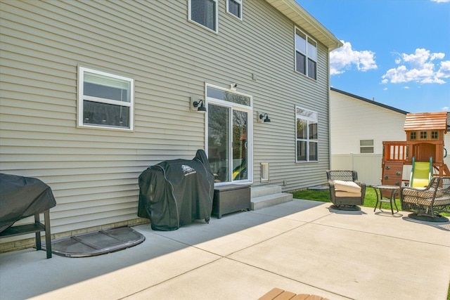 rear view of house with fence and a patio area