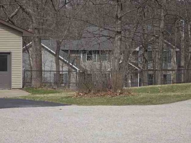 view of home's exterior with fence