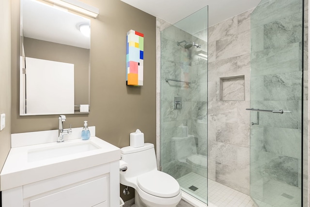 full bathroom featuring a stall shower, toilet, and vanity