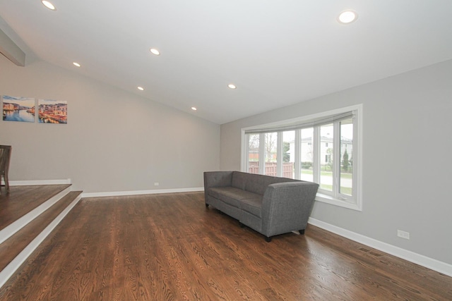sitting room featuring baseboards, recessed lighting, visible vents, lofted ceiling, and wood finished floors