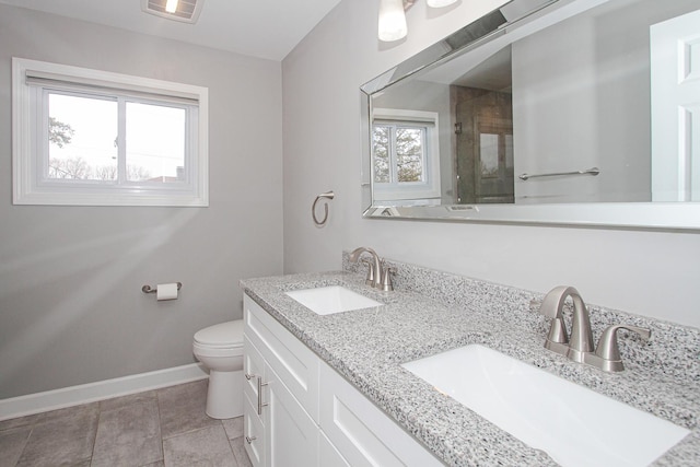 full bathroom featuring visible vents, baseboards, a sink, and toilet