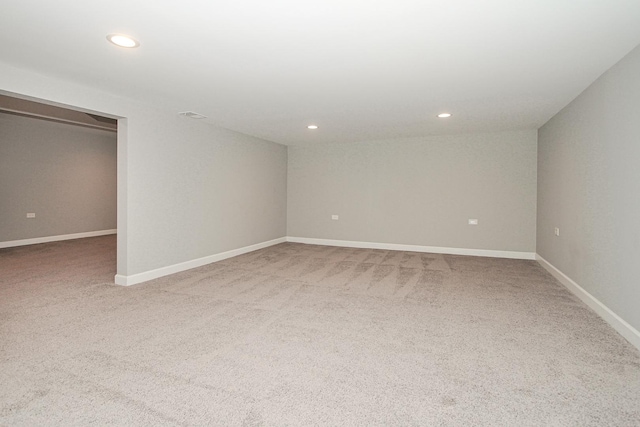interior space featuring baseboards, carpet floors, and recessed lighting