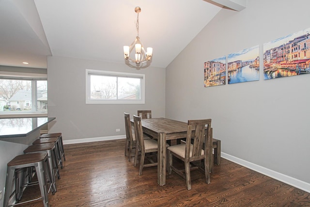 dining room featuring vaulted ceiling, a notable chandelier, dark wood-style flooring, and baseboards