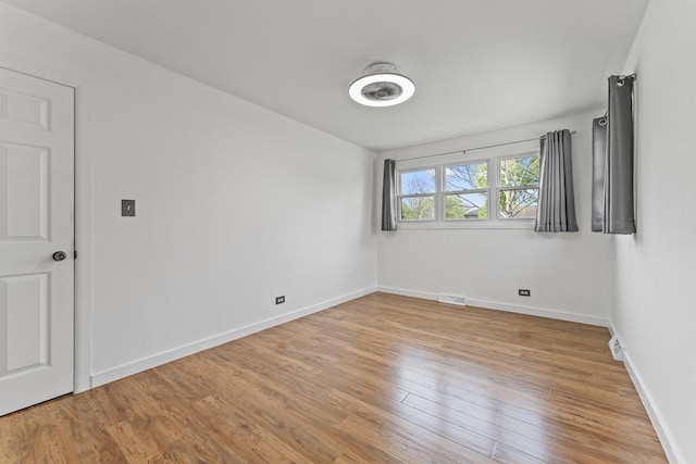 439 N Highview Ave, Elmhurst, IL 60126 - empty room featuring baseboards, light wood finished floors, and visible vents
