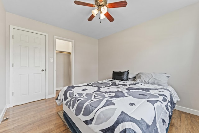 439 N Highview Ave, Elmhurst, IL 60126 - bedroom with baseboards, ceiling fan, a closet, and light wood-style flooring