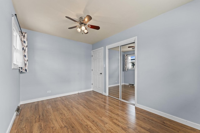 439 N Highview Ave, Elmhurst, IL 60126 - unfurnished bedroom featuring ceiling fan, baseboards, wood finished floors, visible vents, and a closet