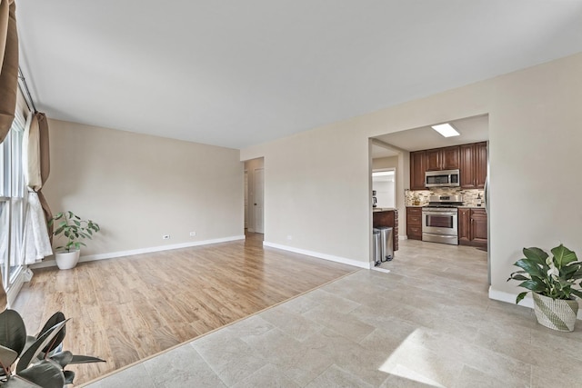439 N Highview Ave, Elmhurst, IL 60126 - unfurnished living room featuring baseboards