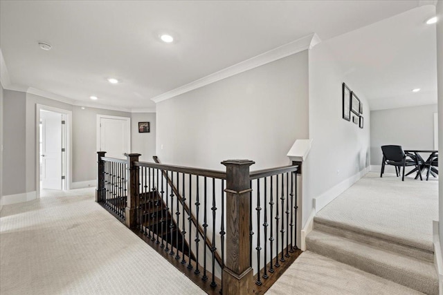 hall featuring crown molding, carpet flooring, an upstairs landing, and recessed lighting