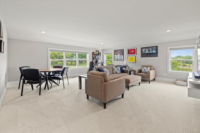 living room with light colored carpet, baseboards, and recessed lighting