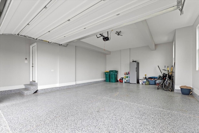 garage featuring baseboards and a garage door opener