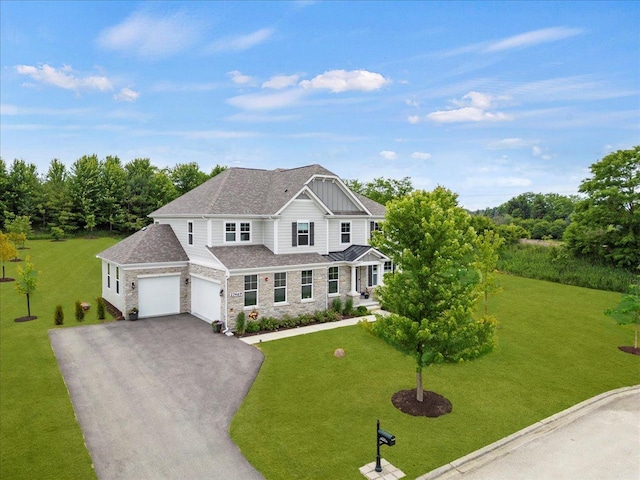 traditional-style home with roof with shingles, aphalt driveway, stone siding, and a front yard