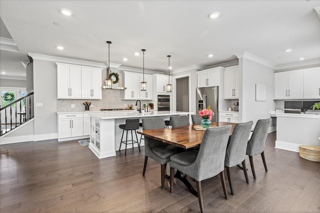 dining room with stairway, dark wood-style flooring, crown molding, and recessed lighting