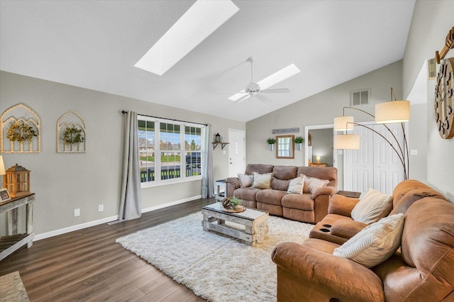 living area featuring visible vents, a skylight, wood finished floors, ceiling fan, and high vaulted ceiling