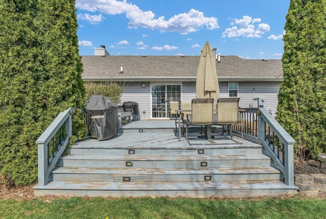 wooden deck with outdoor dining area