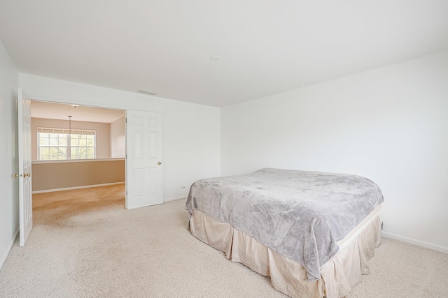 bedroom with carpet, visible vents, and baseboards