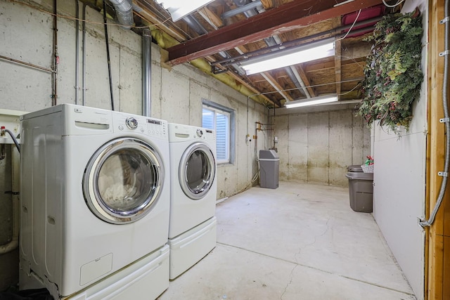 laundry area featuring independent washer and dryer and laundry area