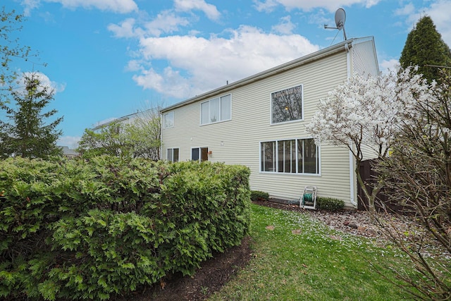 rear view of house with a lawn