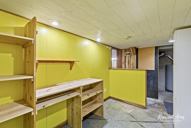 511 N Cleveland Ave, Bradley, IL 60915 - finished basement featuring wood ceiling, water heater, and a workshop area