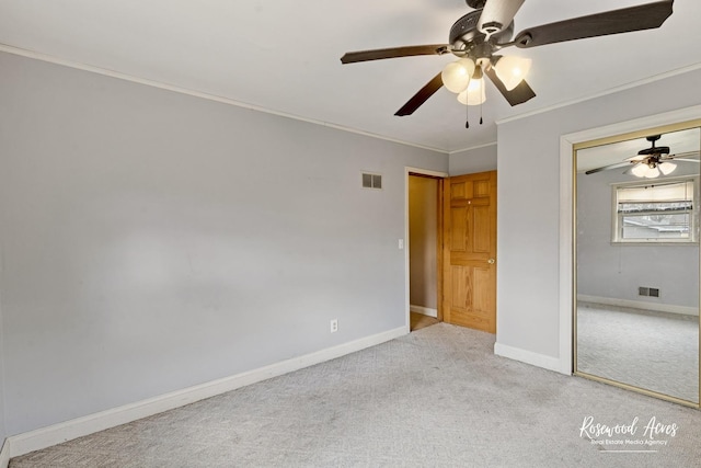 511 N Cleveland Ave, Bradley, IL 60915 - unfurnished bedroom with visible vents, carpet flooring, baseboards, and ornamental molding